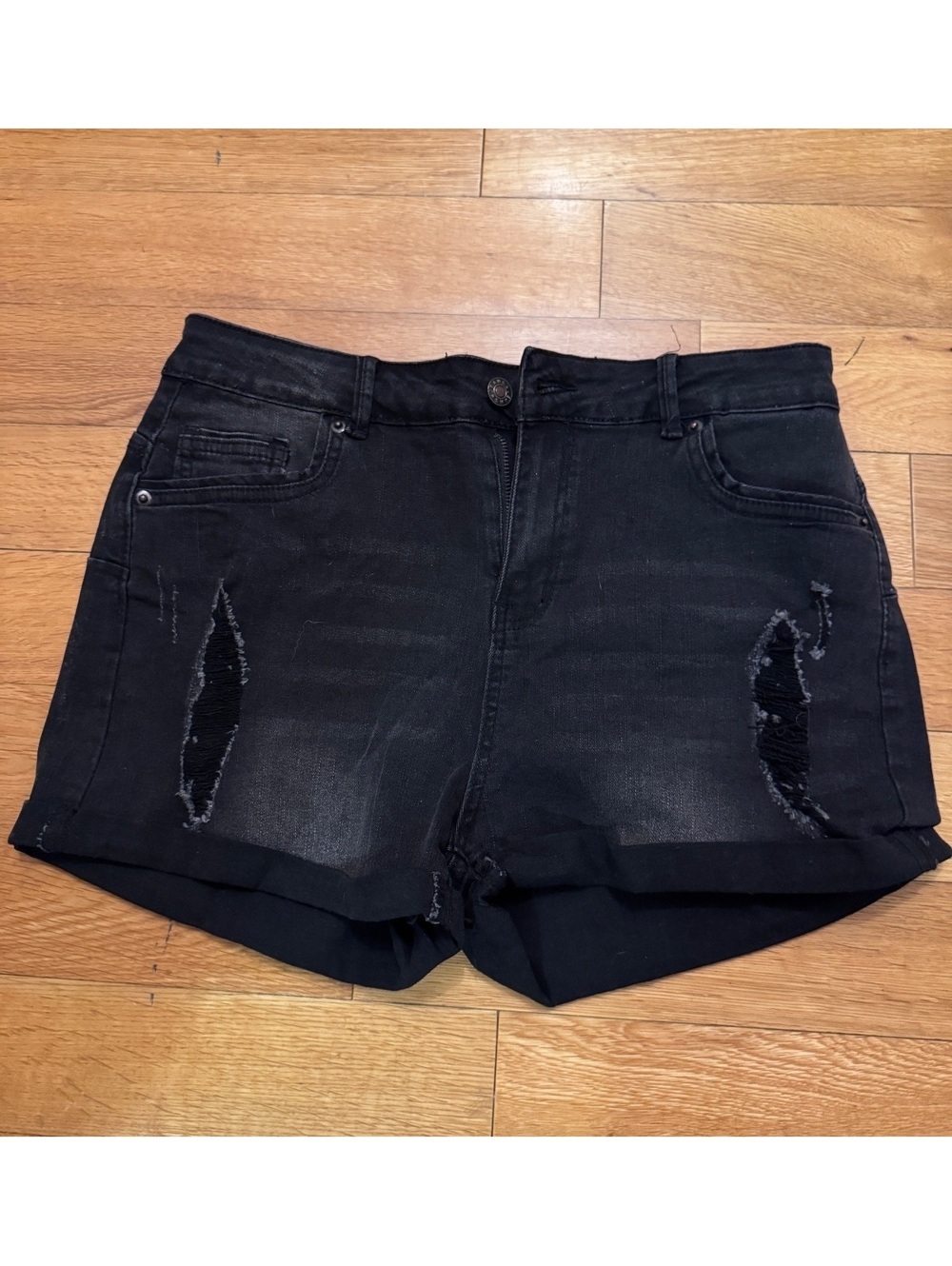 Distressed black high rise rolled hem shorts